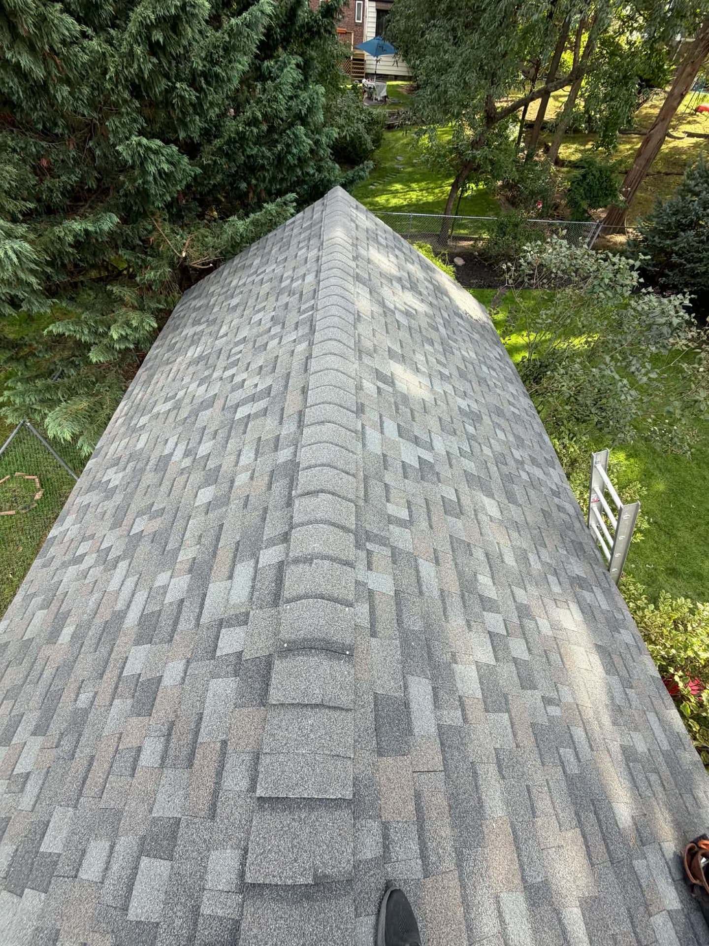 Ridge of an architectural shingle roof after a repair in Villanova, PA