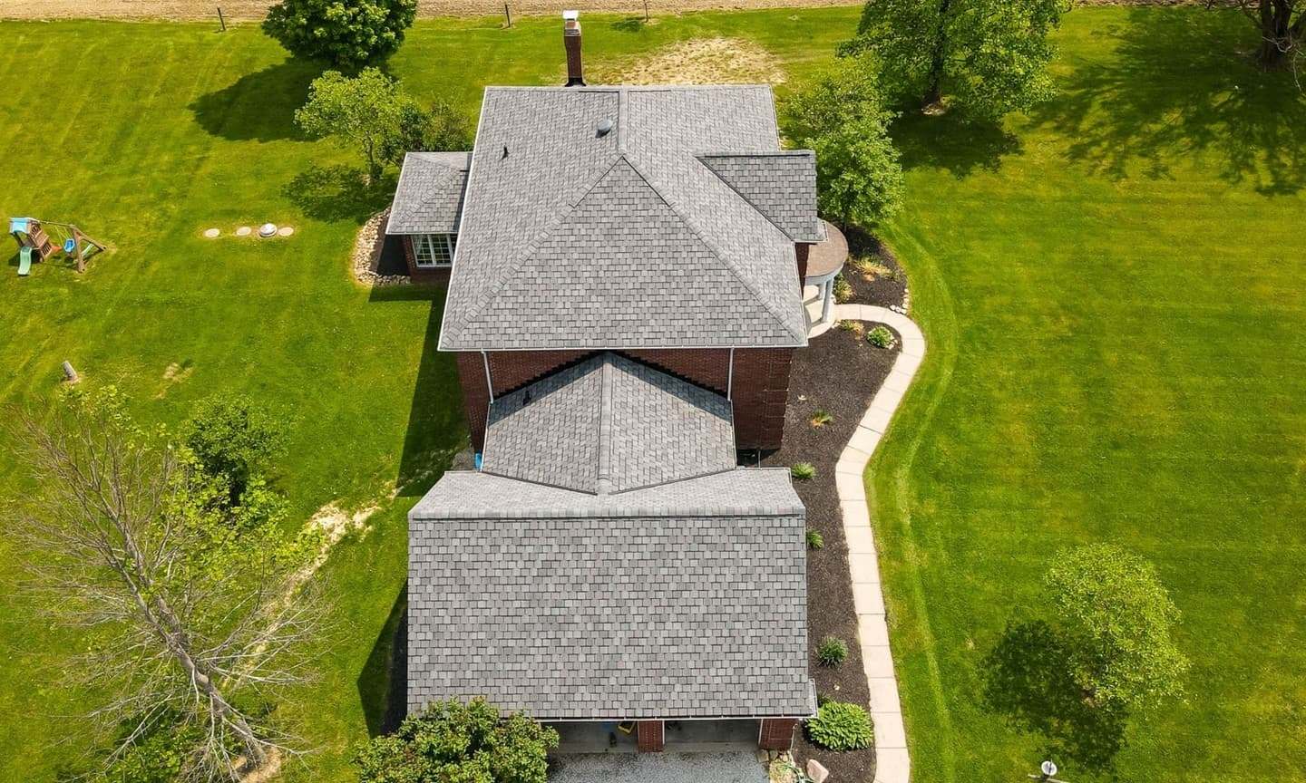 Aerial view of a new grey shingle roof on a brick Bryn Mawr, PA home